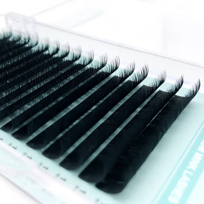 Close-up of artificial fibre false eyelashes with soft velvet finish, showing options from 0.05CC to 0.2CC.