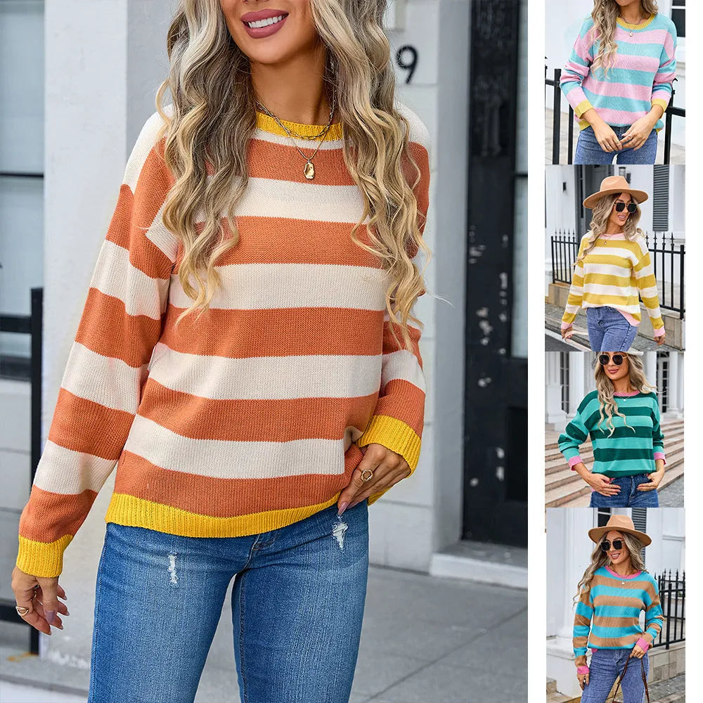Women's loose fit long sleeve acrylic sweater in blue, showing round neck and regular sleeve.
