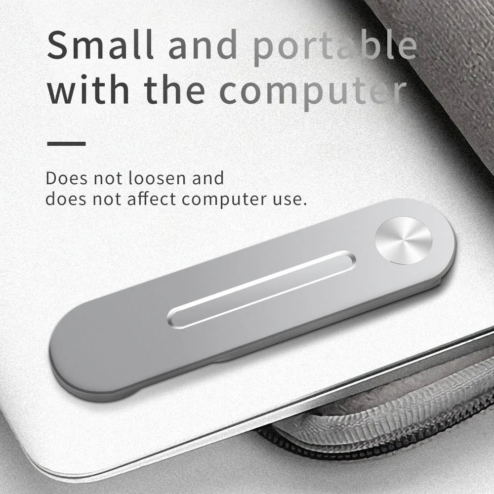 Silver aluminium laptop side mount bracket holding a smartphone, showing adjustable arm and magnetic pads.
