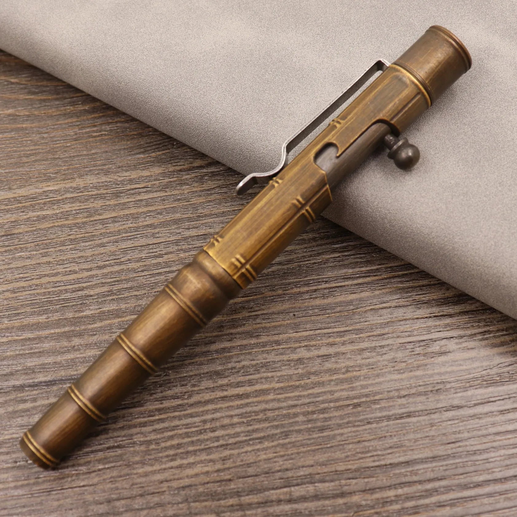 Brass tactical pen with retro colour finish and press mechanism