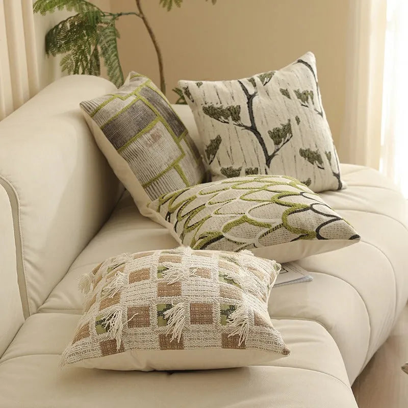Square jacquard pillow cover with retro botanical pattern, shown in one of eight colour options.
