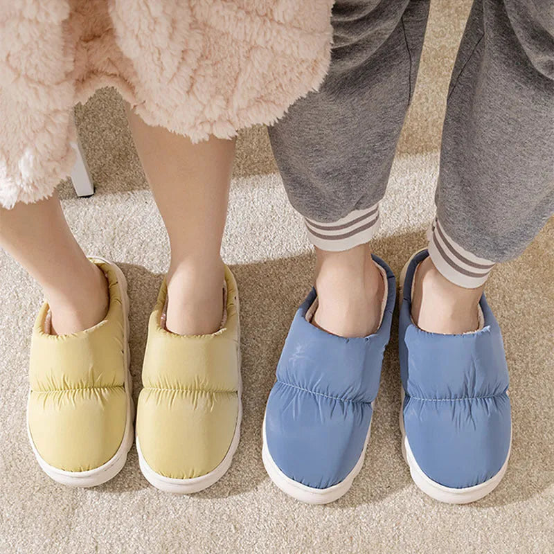 Pair of down cotton slippers with artificial leather upper and thick rubber sole, shown in available colours.
