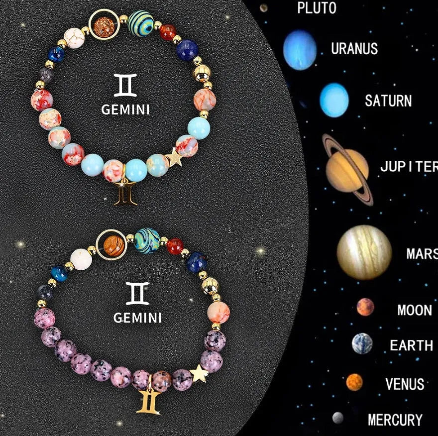 Two adjustable natural stone beaded bracelets with silver zodiac charms on a flat surface.