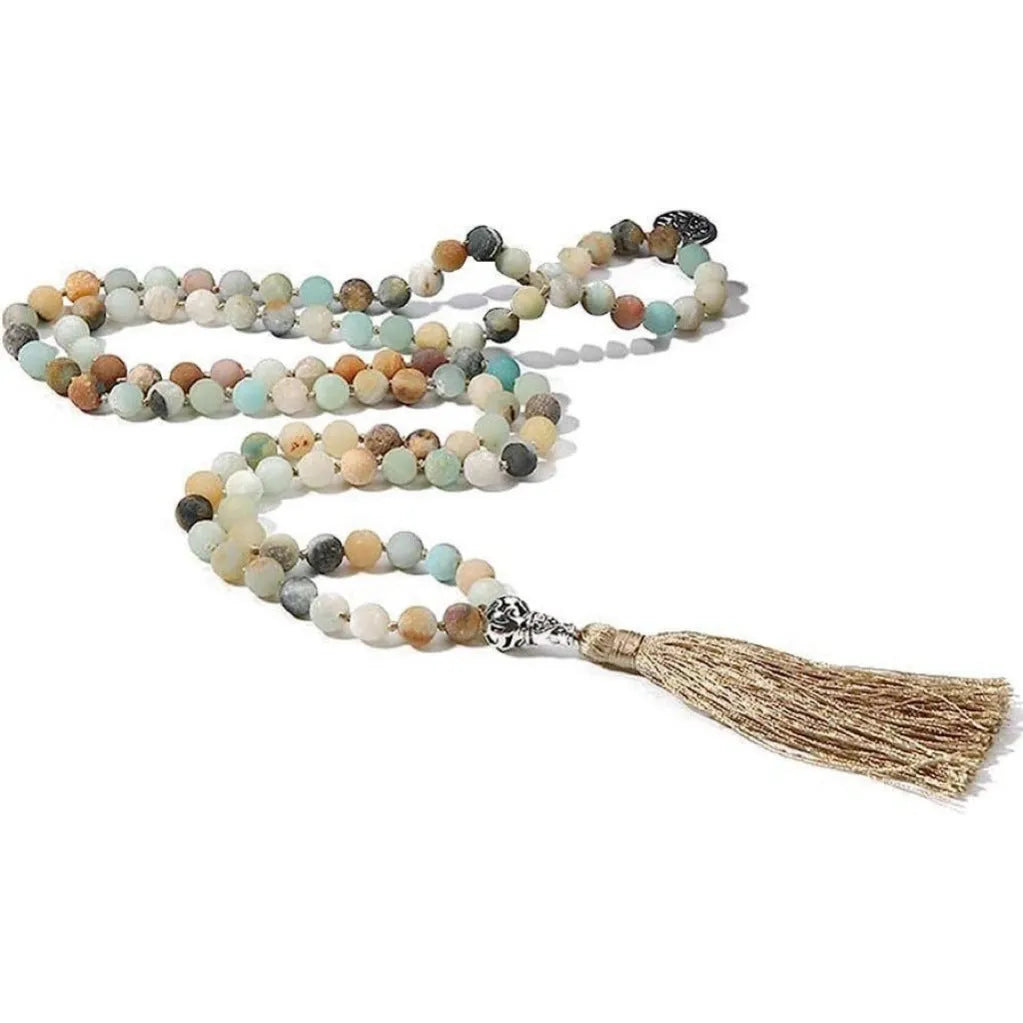 Long handmade necklace with 108 small round stone beads on a black cord, shown doubled up.