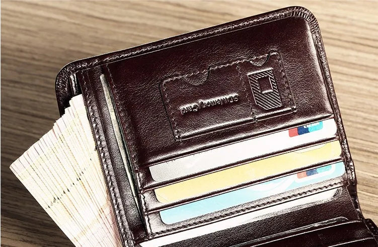 Open view of a black men's leather bifold wallet showing card slots, photo window, and zipped coin pocket.