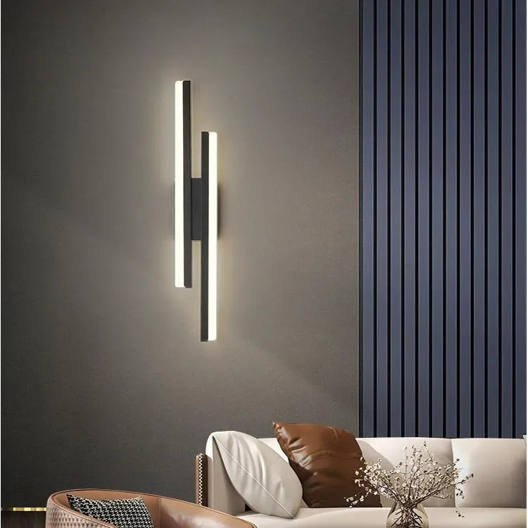 Minimalist Scandinavian-style LED wall light with acrylic shade in black or gold finish