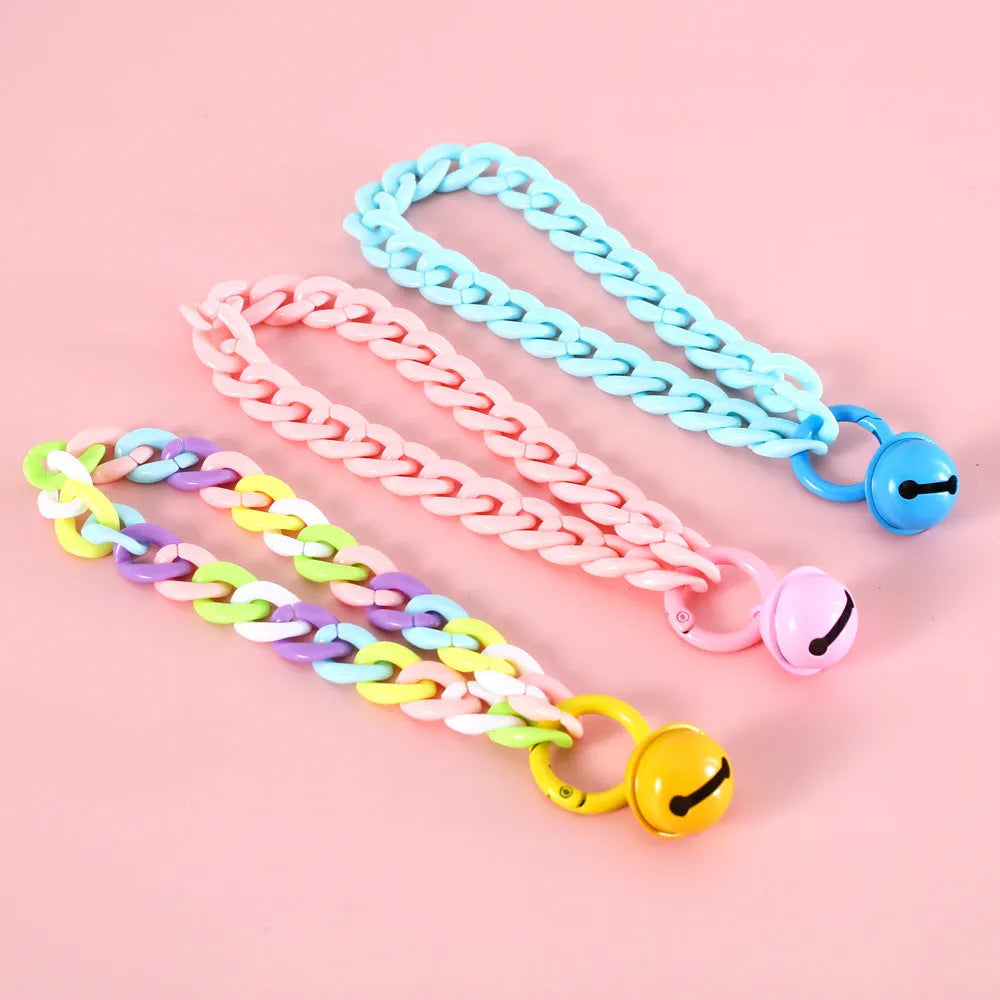 Adjustable plastic pet collar in candy chain blue colour on a white background, showing the monochrome pattern.