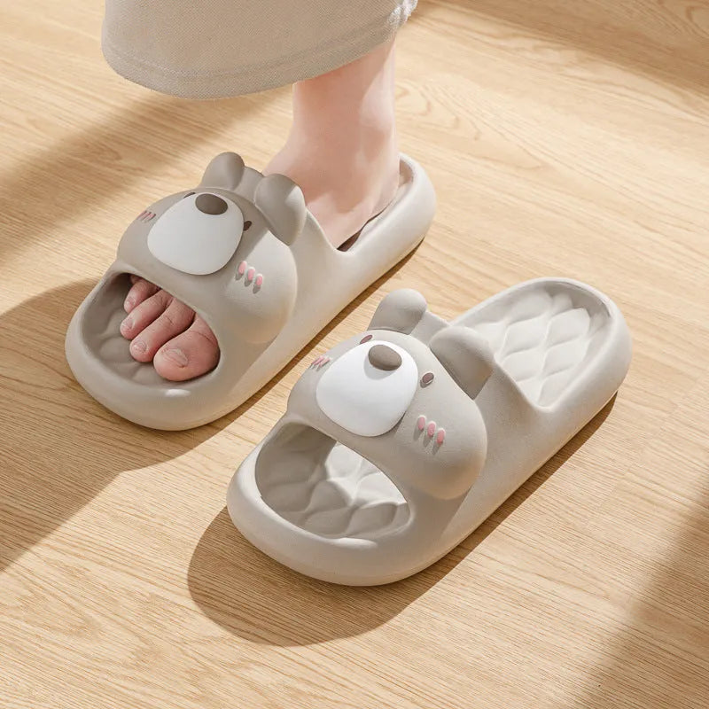 Pair of brown cartoon bear EVA flip flops for adults, toe baring sandal style