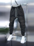 Men's light blue skinny jeans with drawstring mid waist and elastic ankle cuffs, cotton denim pencil pants