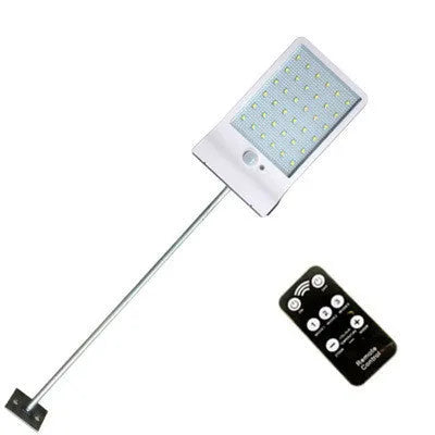 Black and white waterproof solar-powered LED garden light for outdoor use.