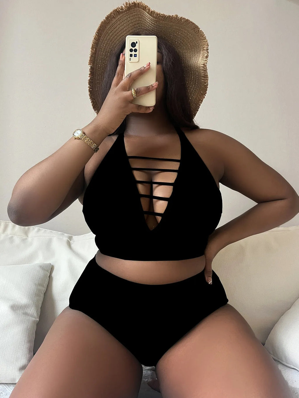 Plus size woman in a solid colour halterneck bikini with adjustable cross-back straps.