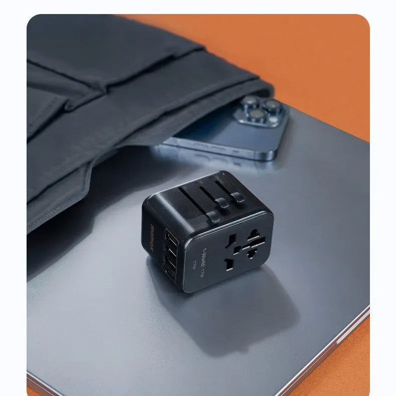 Black universal travel adapter UA12 with four-bit multi country converter, 70x64x48mm PC housing