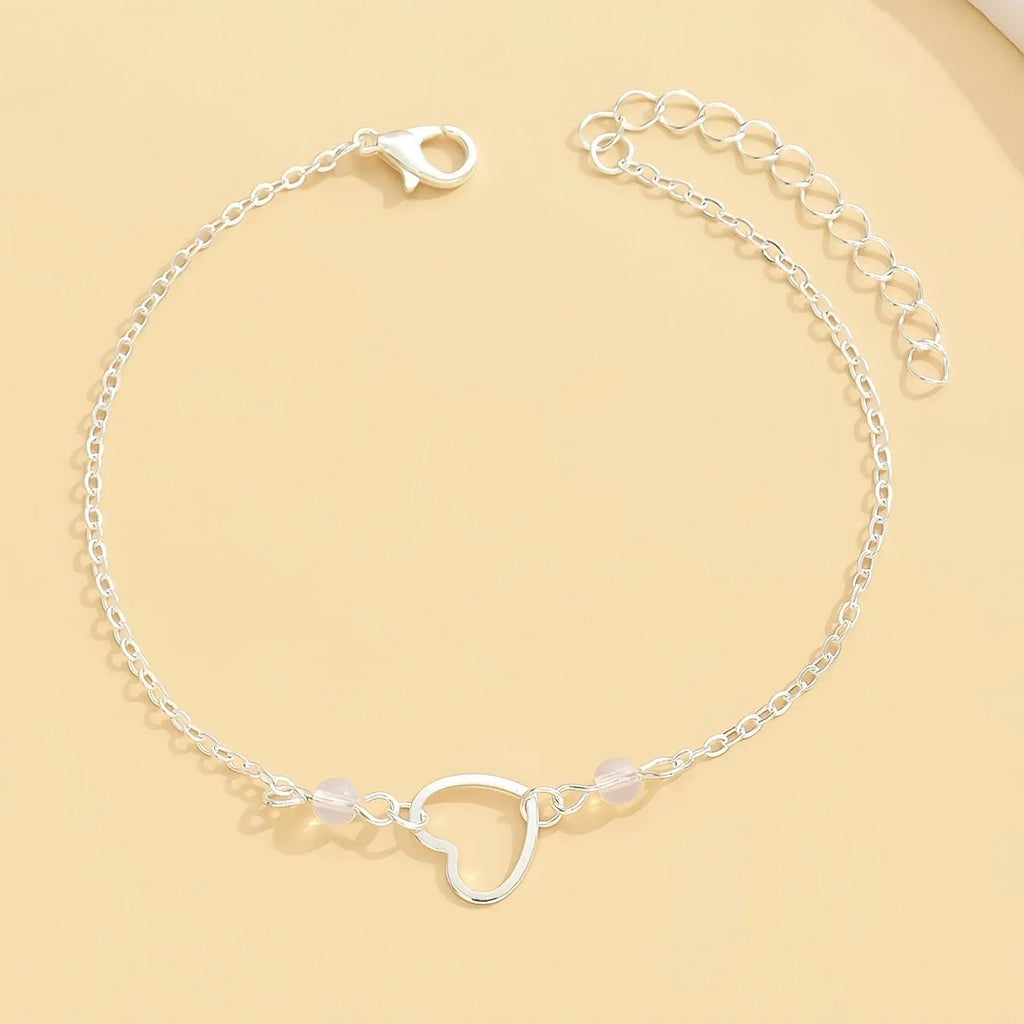 Adjustable alloy anklet with small heart pendant in gold or silver finish