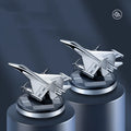 Solar powered rotating fighter aircraft perfume ornament in silver, gold, blue, or red colour.