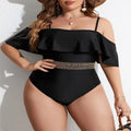 Black women's one-piece swimsuit on a hanger, plus size range 0XL to 4XL.