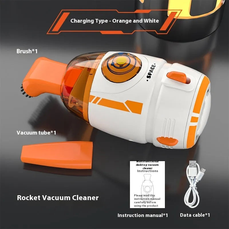 USB-powered handheld desktop vacuum cleaner in blue rocket design on a wooden desk.