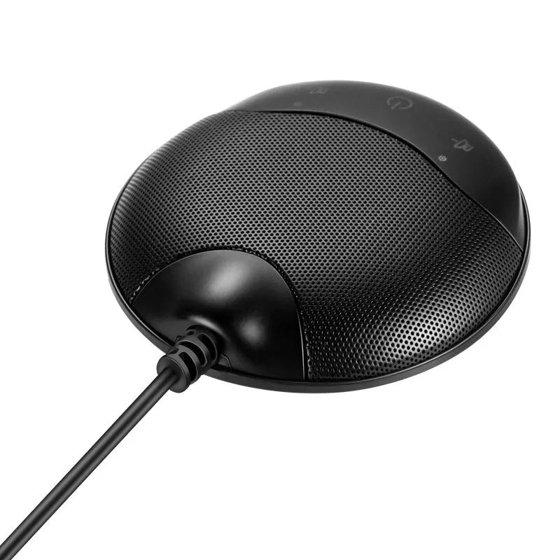 Black USB condenser microphone for conferences and gaming on a desk.