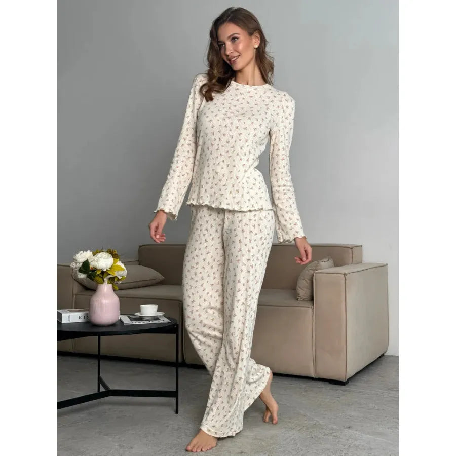 Women's white floral print bell sleeve top and wide-leg trousers loungewear set on a hanger.
