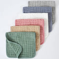 Set of six large muslin burp cloths 25x50cm in assorted colours on white background