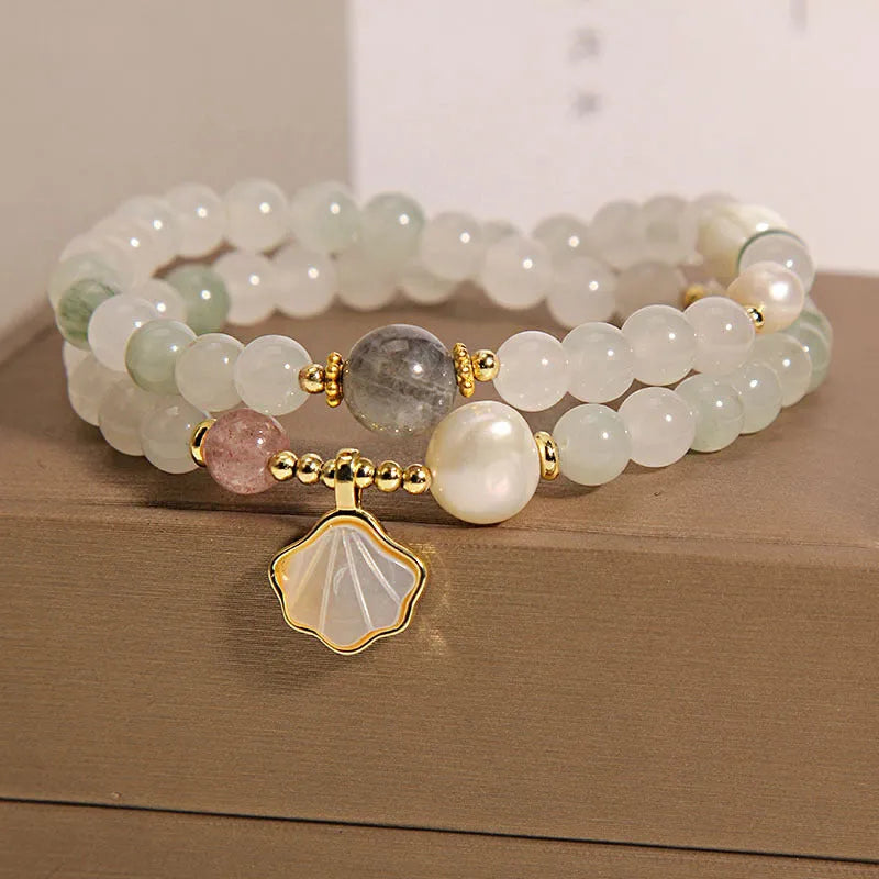 Women's crystal bracelet with a green Tianshan jade shell ginkgo leaf pendant, gold-plated accents, and rhinestones.
