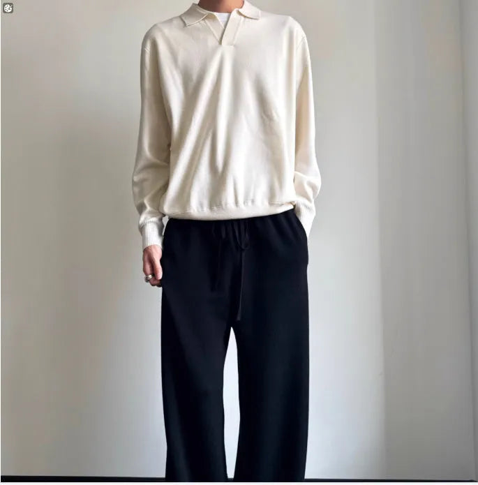 Pure wool polo sweater with lapel collar in milky white, shown in a loose fit.