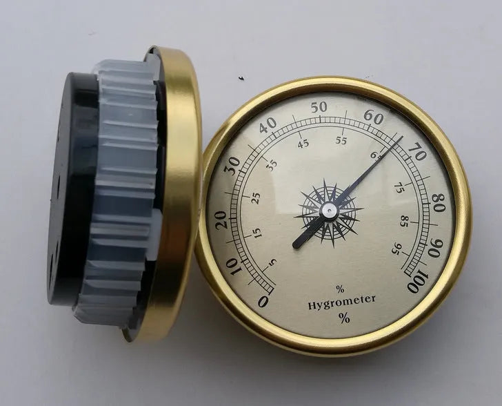 Silver aluminium analog thermometer and hygrometer on a white background.