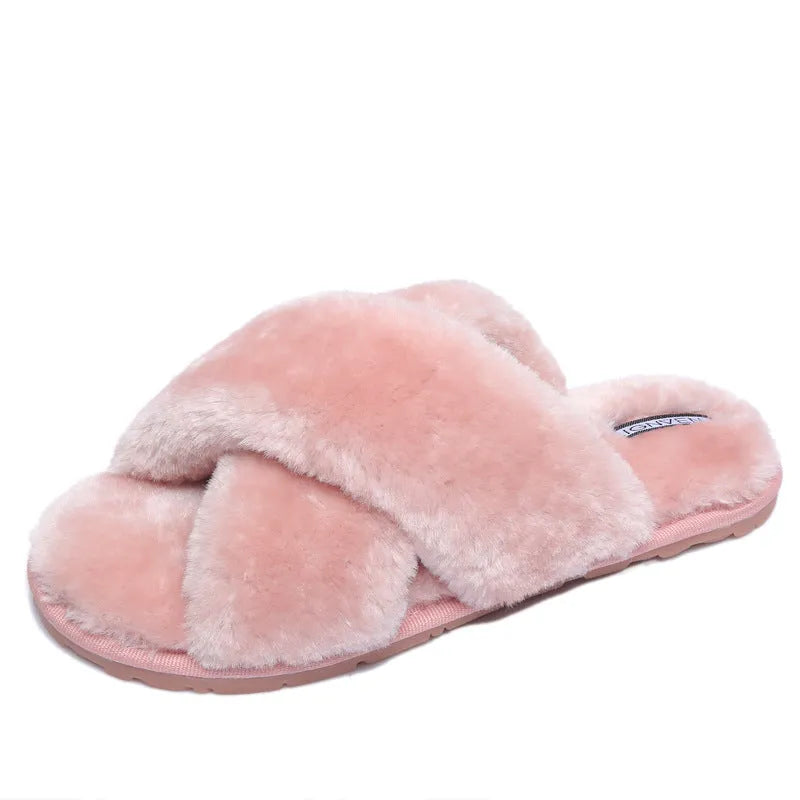 Women's black open-toe fur slippers with a cross-strap design and textured non-slip rubber sole.