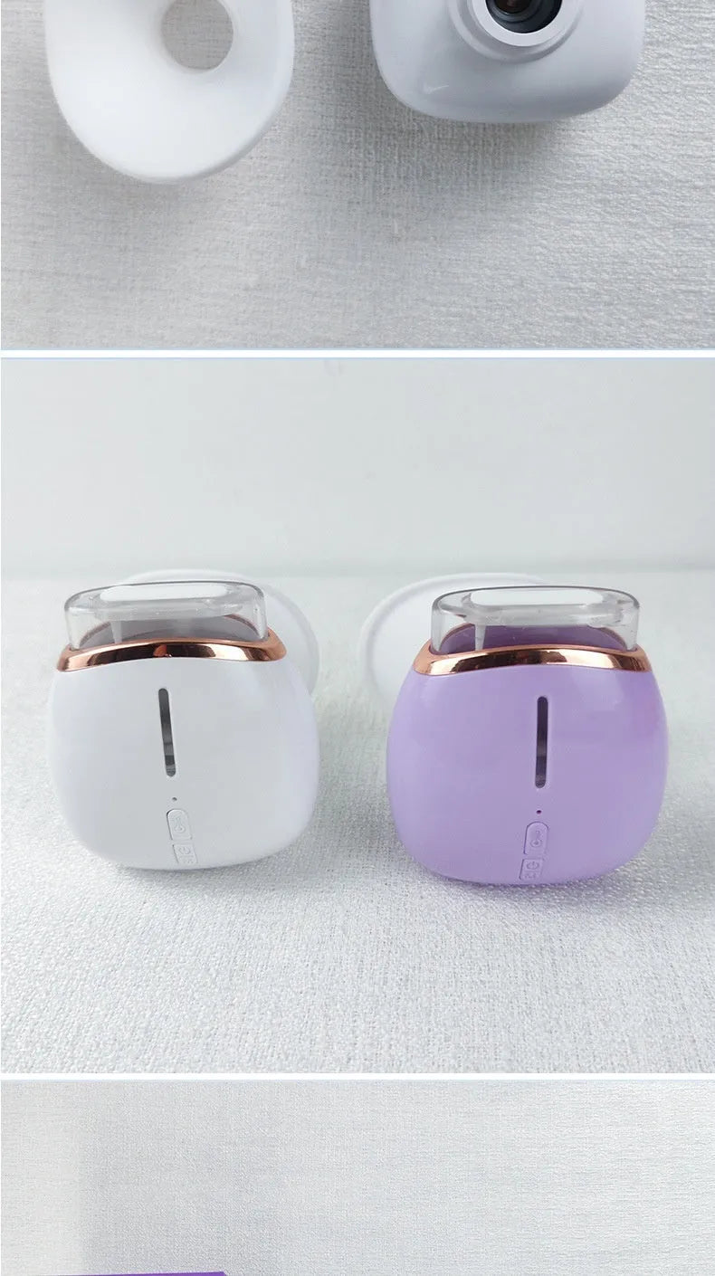 White or purple household eye humidifier device with lithium battery operation and USB charging cable