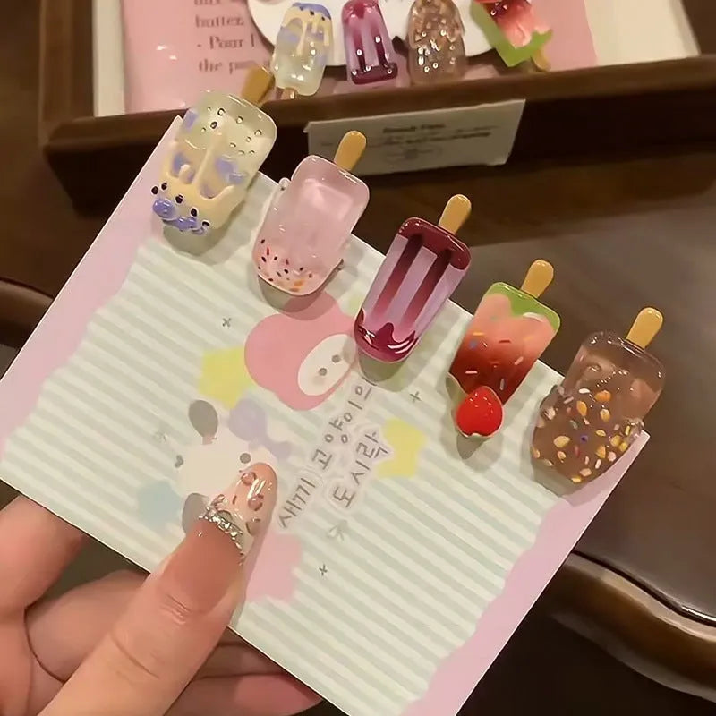 Cartoon ice cream design resin hair barrette clip in side view showing colour options.
