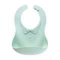 Waterproof soft plastic children bib with cartoon pattern in red, green, and blue colour options