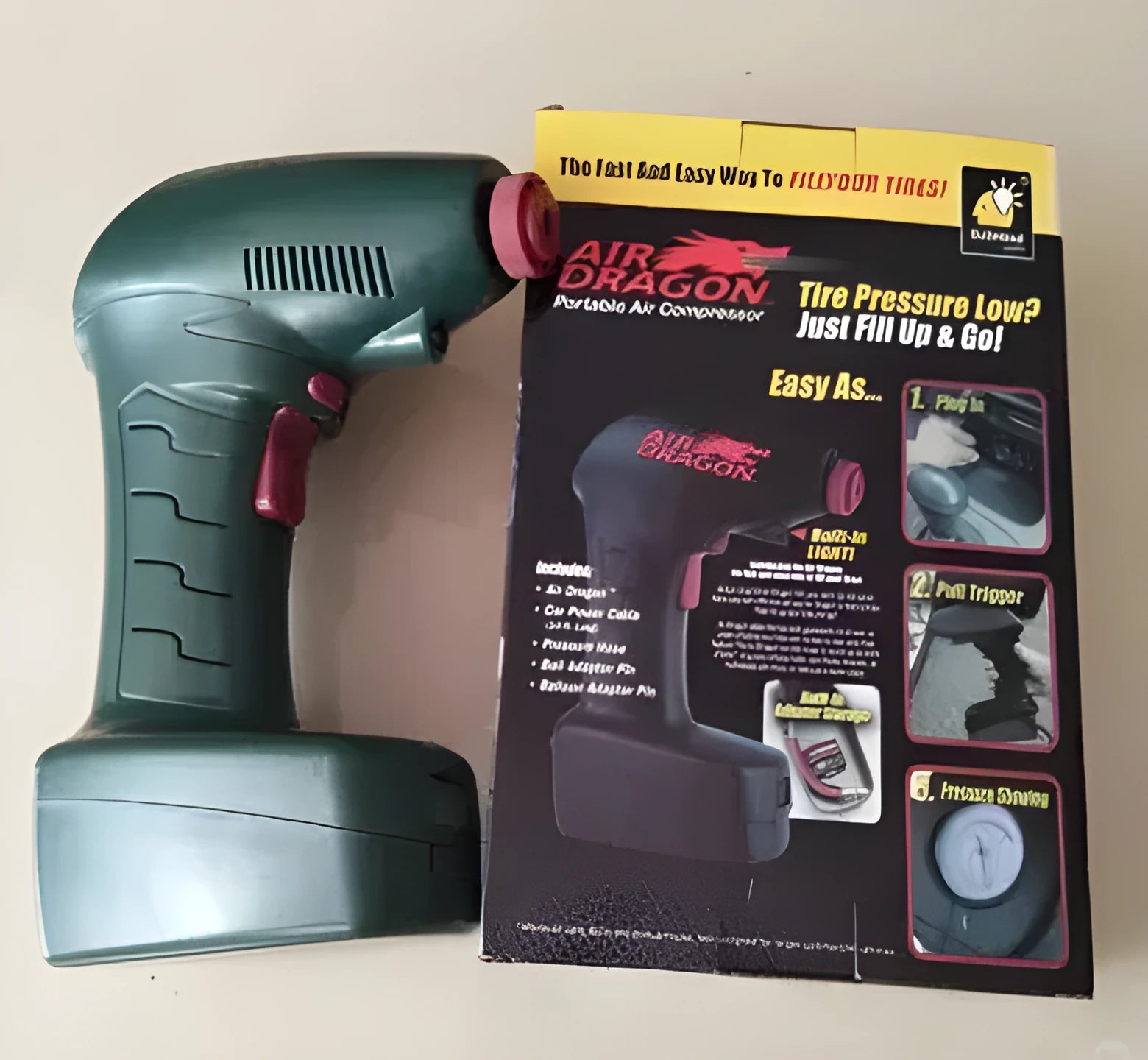 Portable 12V electric car tyre pump with LED light and air hose.