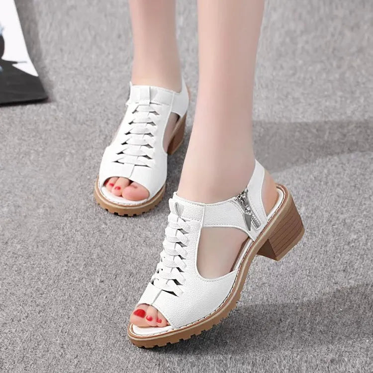 Women's black sandals with side zip and mid heel on a beef tendon sole.