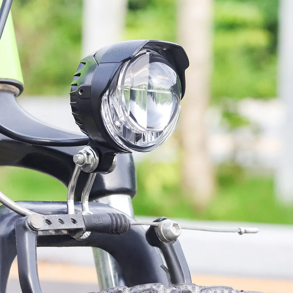 Black electric bike headlight with 3W power and 85 lux brightness, IPX4 waterproof, on handlebar mount