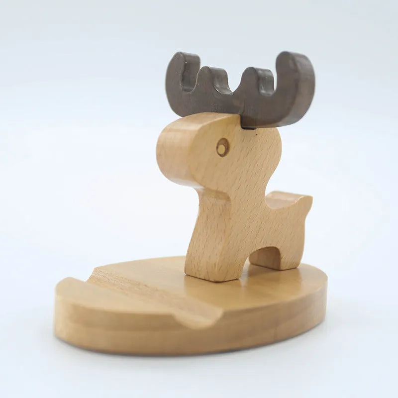 Solid beech wood phone holder with resin puppy decoration and a pound coin in the integrated slot.