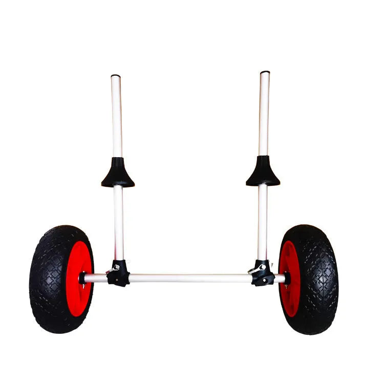 Foldable aluminium kayak cart with upright pole and rubber tyres on a beach, loaded with a yellow kayak.