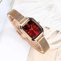 Women's square casual retro watch with rose gold shell and thin 8mm profile on wrist.