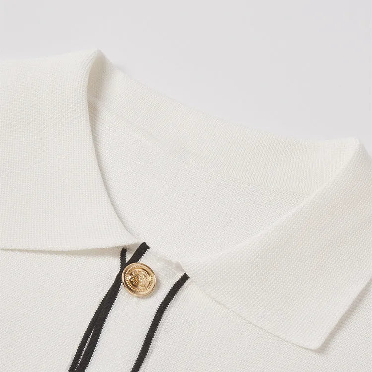 White short-sleeve cardigan with dark contrast colour lapels, buttoned front, and a relaxed fit.