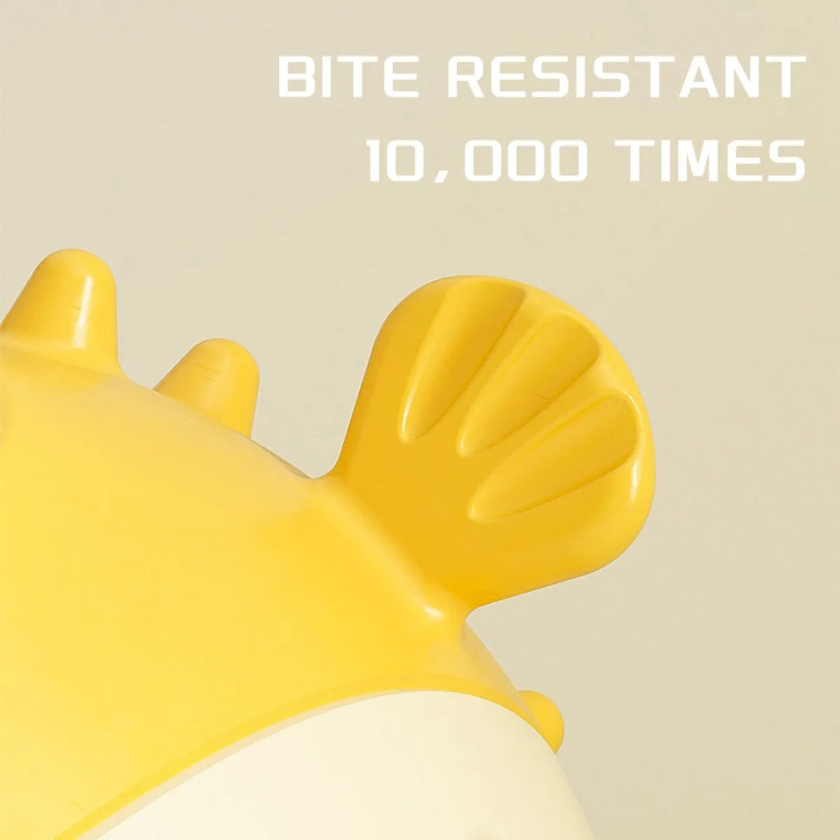 Yellow vinyl fish-shaped dog chew toy with textured surface and squeaker inside.