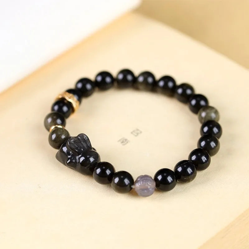 Handmade Chinese national style obsidian bracelet with lying rabbit charm and mixed metal and agate beads.