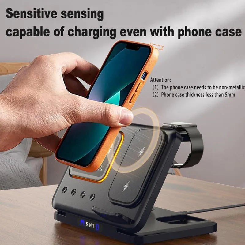 Black wireless charging station with digital display showing time and temperature, charging phone and watch