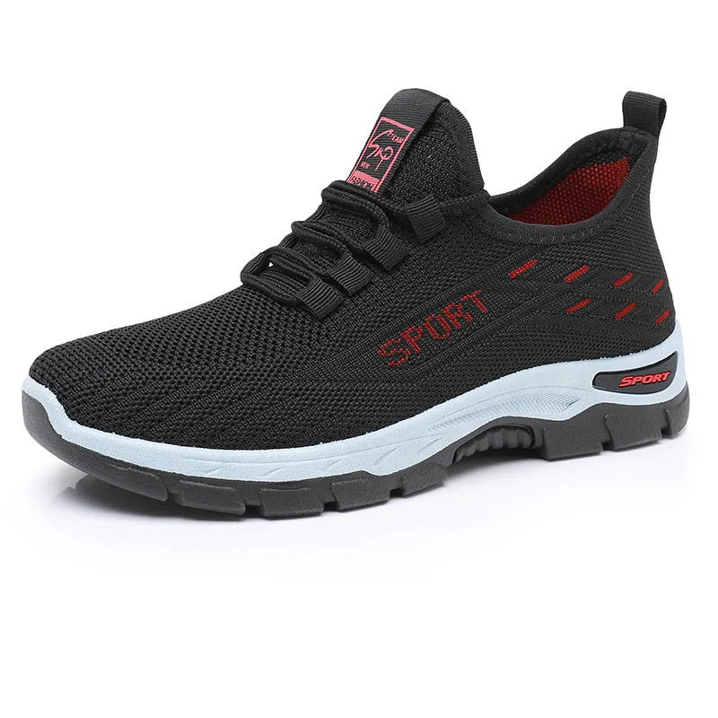 Low-top casual sneaker with round toe and PVC sole in black, shown on a white background.