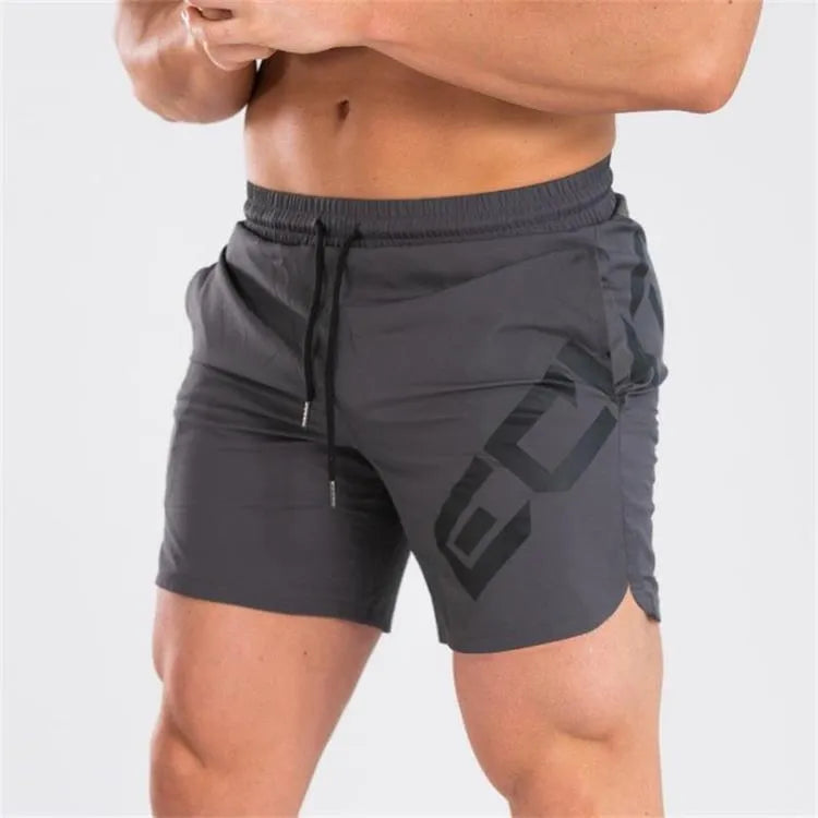 Men's elastic knee-length training shorts in quick-drying chemical blend fabric shown in black colour