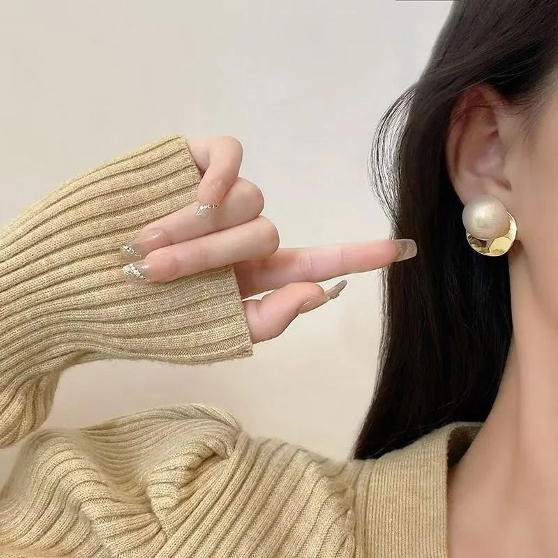 Fashionable alloy round drop earrings in gold tone, 1.2 cm diameter, on a white background