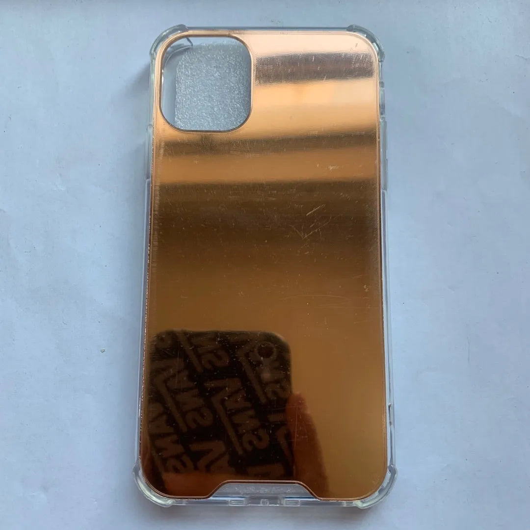TPU mirror phone case for iPhone on a table, showing anti-fingerprint finish.