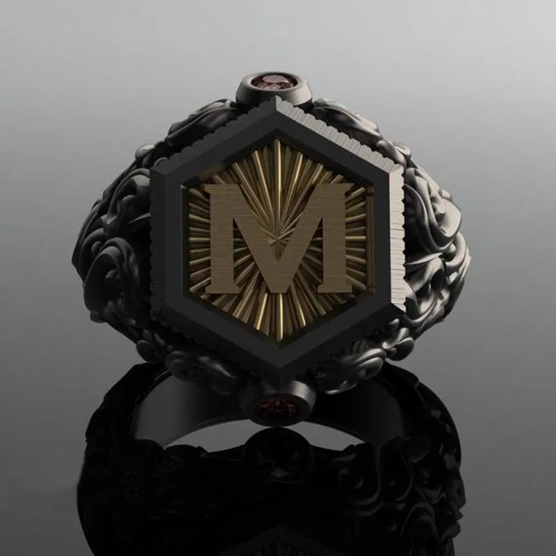 Black alloy decorative ring with carved leaf design on white background