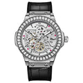 Automatic men's watch with diamond studded hollow dial in a white case.