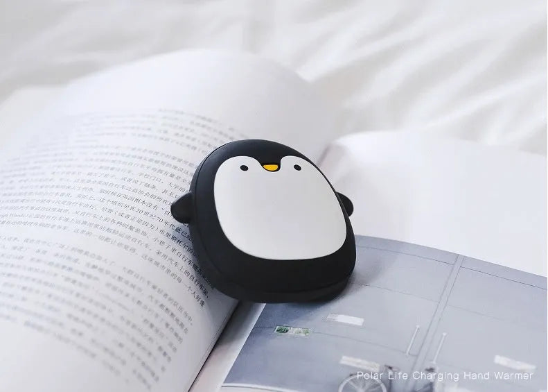 Cartoon penguin and polar bear USB rechargeable hand warmer and power bank showing double-side heating