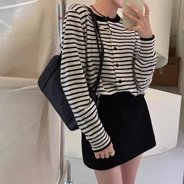 Dark grey and white striped women's cardigan coat with long sleeves and a short, slim fit.