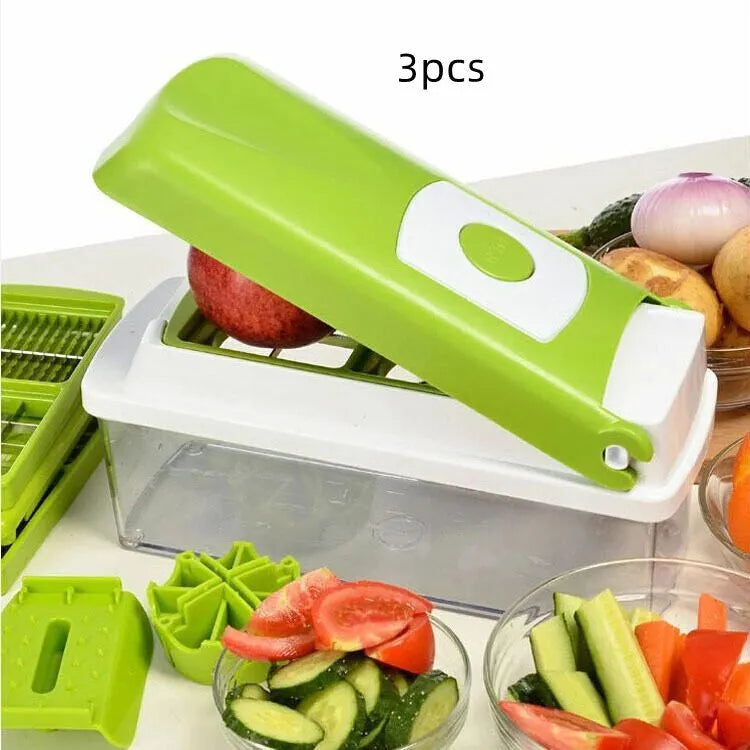 Green handheld manual food chopper with stainless steel blades on a white background.