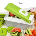 Green handheld manual food chopper with stainless steel blades on a white background.